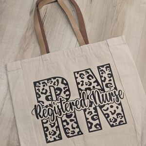 Registered Nurse Canvas Tote Bag in Cream with Black Print. Leather Handles.